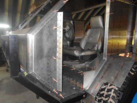 1992 Ford Bronco - Custom vehicle interior construction in progress, showing seats and unfinished metalwork.