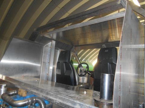 1992 Ford Bronco - Custom vehicle interior under construction with bare metal and basic seating visible.