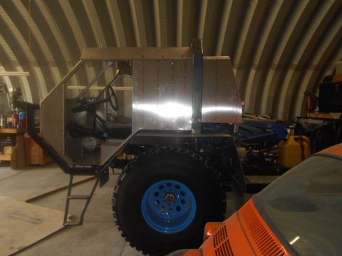 1992 Ford Bronco - This custom vehicle appears to be in the process of construction, with exposed metal and large off-road tires visible.