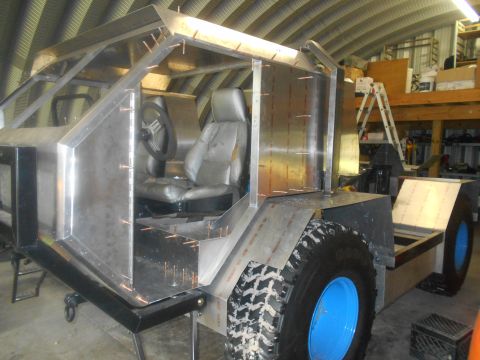 1992 Ford Bronco - A custom vehicle is being constructed with a metal body and interior components visible.