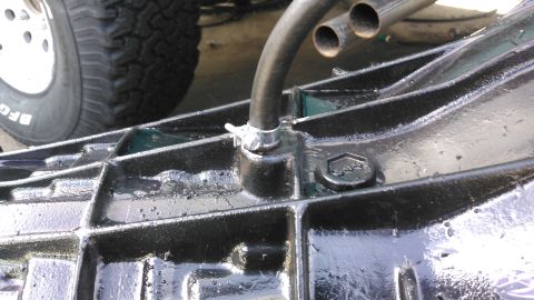 1996 Ford Bronco - i forced the hose over it and to make sure it will not come off, i used a fuel injection hose clamp. when the tranny is installed i will ru…