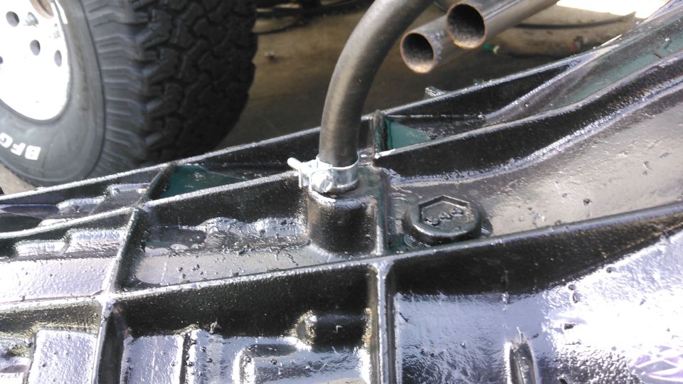 i forced the hose over it and to make sure it will not come off, i used a fuel injection hose clamp. 

when the tranny is installed i will run the other end up to the hood