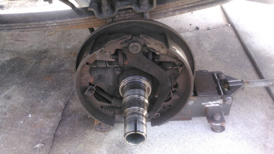 take off the spindle nut and then you can pull the entire hub off.

the spindle seal will be abit stuck to the spindle, just pry it off