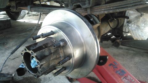 1990 Ford F-250 - mounted the new rotor on and used a couple lug nuts to hold it tight