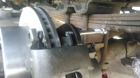 1990 Ford F-250 - issue i found is that i cant get the upper caliper pin in or out easily because of the leaf spring. i debated keeping the bracket like this…