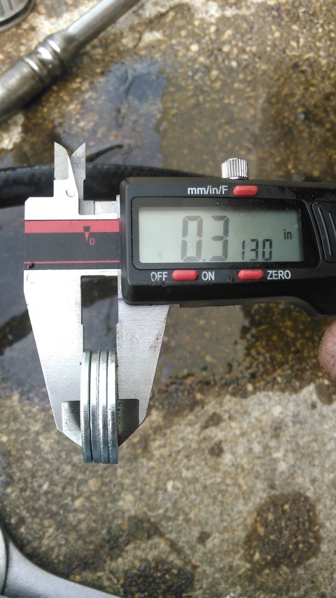1990 Ford F-250 - this is how much of a shim i used betweent he axle mounting and the caliper bracket. i could probably of used less. i did need longer bolts…