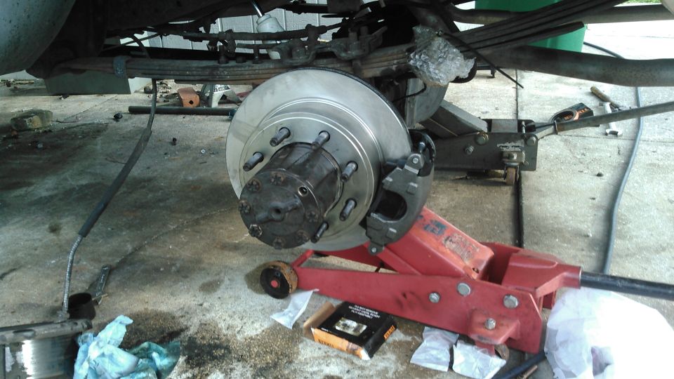 i went ahead and replaced the wheel bearings and seals. then i did final install.

tighten the spindle nut to 55-65 ft-lb while rotating hub. on new bearings, you back off the sprindle 5 clicks, on used bearings 8 clicks

the axle flange bolts get torqued to 60-80 ft-lb

note: according to my official ford manual, the flange bolts get torqued last, after wheel is on and torqued. not sure whay