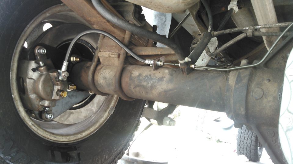 i made a new pair of brake lines. driver side is going to be very short. the passenger side i formed to be line the original but shorter.

some kits have tabs that you can weld to the axle so it holds the brake hose