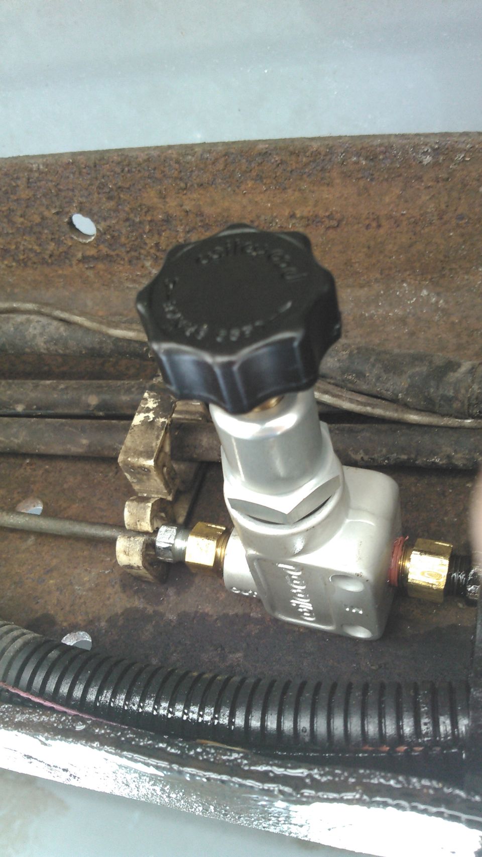 i added a Wilwood 260-8419 brake proportioning valve. along the frame on the brake line. this is used to adjust the brake pressure on the rear brakes.

screwed in gives more pressure, screwed out gives less pressure.  ideally the front should do about 70% of the braking and the rear 30%.

how i adjusted it is by doing a hard stop and seeing how easily the brakes lock up. i reduced the pressure till the rear brakes would no longer lock up
