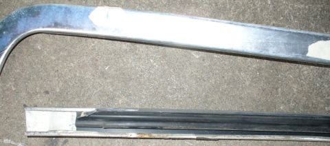 1992 Ford Bronco - Windshield header trim removal. Closeup showing the thin metal lip the clips hold onto.