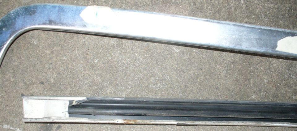 Windshield header trim removal. Closeup showing the thin metal lip the clips hold onto.