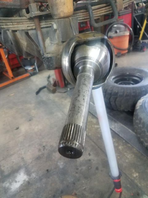1987 Suzuki Samurai - Front axle joint and suspension components are visible in this close-up shot.