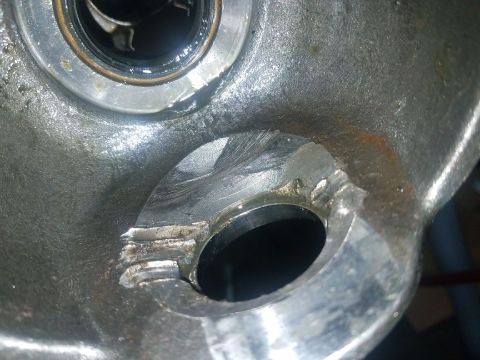 1987 Suzuki Samurai - Detail of a worn metal component, possibly from a vehicle's drivetrain or axle assembly.