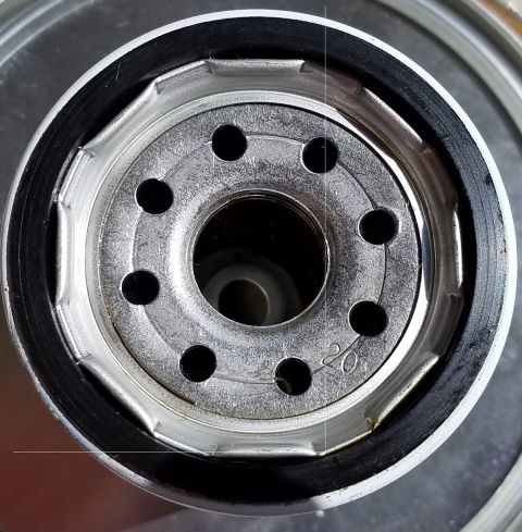 2000 Ford Crown Victoria - Close-up view of an oil filter, showing a '20' marking on its metal casing.