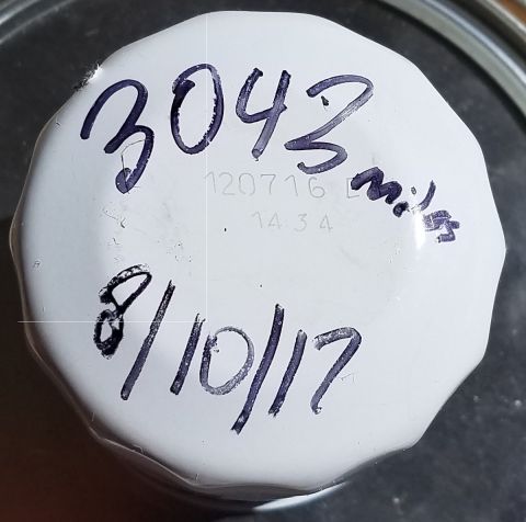 2000 Ford Crown Victoria - Oil filter marked with mileage and date, likely for maintenance tracking.