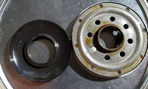 2000 Ford Crown Victoria - Close-up of an oil filter and its gasket, showing part numbers and wear.
