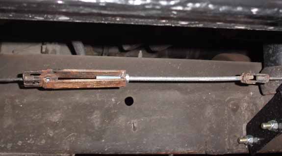 Adjustable threaded turnbuckle linkage rod mounted under a vehicle chassis