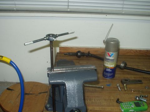 1978 Ford Bronco - Tapping end of stock clutch rod after 90 degree bend is cut-off. used 3/8-24 NF tap.