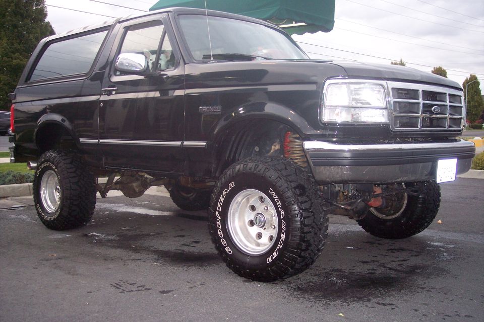 Black lifted 1995 Ford Bronco 3/4 front view