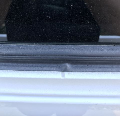 1995 Ford Bronco - Small dent on the door panel of a vehicle, with a SUPERMOTORS.NET watermark.