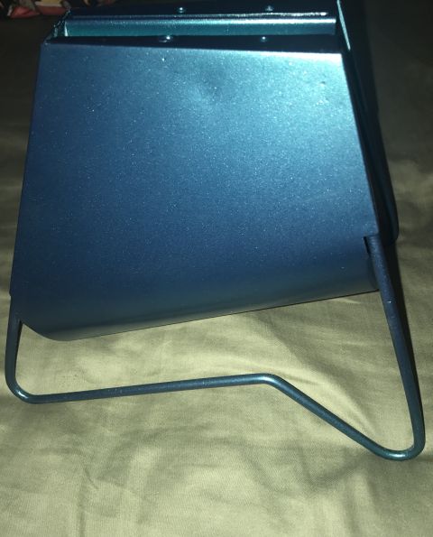 1995 Ford Bronco - This is a metal part with a blue finish and wire legs, photographed from the side.