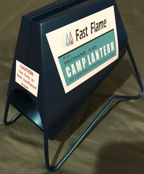 1995 Ford Bronco - A dark blue metal camp lantern with labels indicating it is a Fast Flame propane gas model.