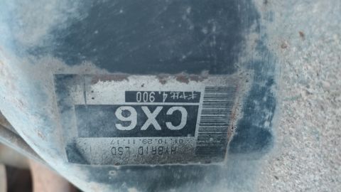 2002 Mitsubishi Montero Sport - A close-up of a part label shows the text CX6 and HYBRID LSD, along with a date and barcode.