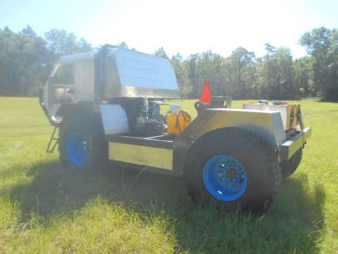 1992 Ford Bronco - This custom vehicle has a unique aluminum body and large off-road tires.