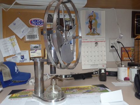 1994 Ford Bronco - A desk scene includes a metal fan, a calendar showing April 2017, and assorted documents.