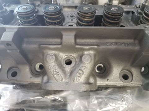 1969 Pontiac Firebird - Close-up view of an engine cylinder head, showing casting marks and a part number.