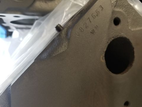 1969 Pontiac Firebird - Close-up of an engine block casting showing stamped numbers and letters.