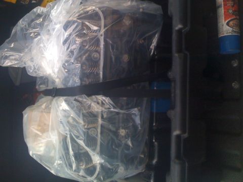 1995 Ford F-150 - Engine cylinder heads are wrapped in plastic and secured with a strap.