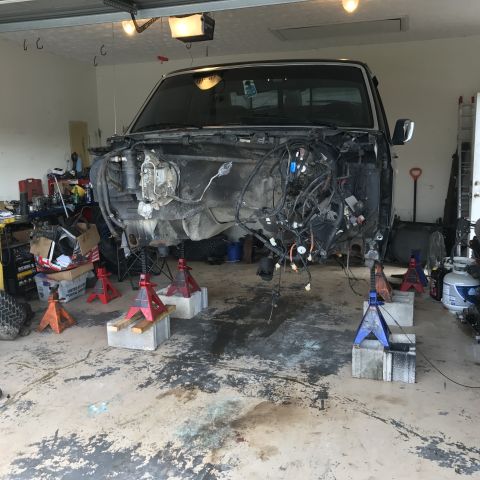 1995 Ford F-150 - Front clip removed from a 1995 Ford F-150, exposing engine bay and wiring.