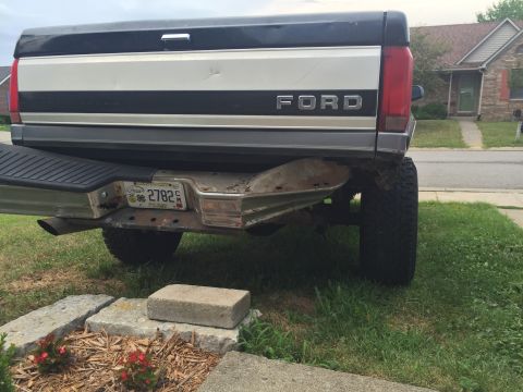 1995 Ford F-150 - The rear passenger side of a Ford pickup truck is shown, featuring a license plate from Kentucky that reads "2782". The truck has a two-ton…