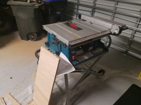 1994 Ford Bronco - A table saw is shown with a piece of wood and some papers.