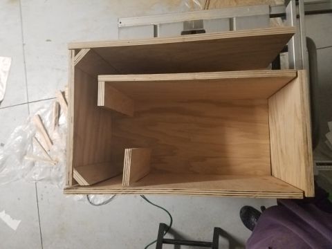 1994 Ford Bronco - A custom-built wooden enclosure with internal shelving is shown, likely for audio equipment.