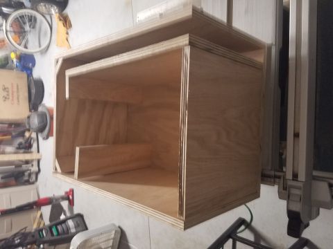 1994 Ford Bronco - A custom-built wooden enclosure is shown in a workshop setting.