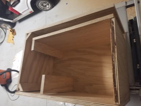 1994 Ford Bronco - A custom-built wooden enclosure, likely for a car stereo system, is shown in detail.
