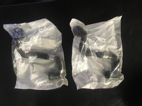2010 Dodge Challenger - Two new fuel lines are shown packaged for sale, with visible labels on each.