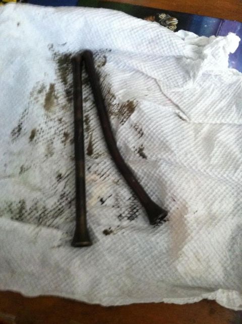 1987 Ford Bronco II - Bent pushrods are visible on a paper towel, indicating potential engine damage.