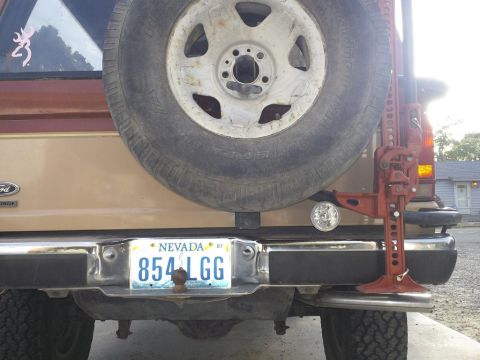 1987 Ford Bronco II - Rear view of a 1987 Ford Bronco II, equipped with a spare tire and a Hi-Lift jack.