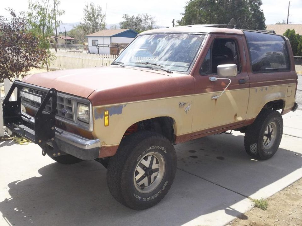 1987 Ford Bronco II with a brush guard and two-tone paint