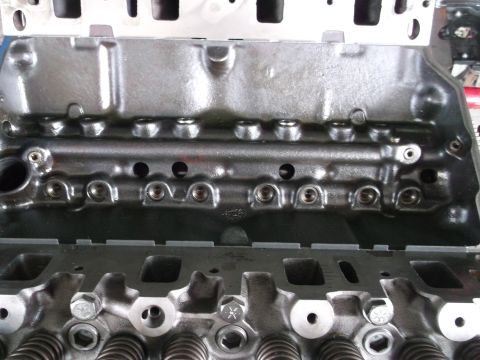 1970 Ford Torino - This image shows internal engine components, specifically an engine block and cylinder head, with visible bolts and valve springs.