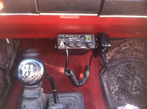 1987 Ford Bronco II - A Midland CB radio and a chrome gear shifter are visible inside the vehicle's interior.