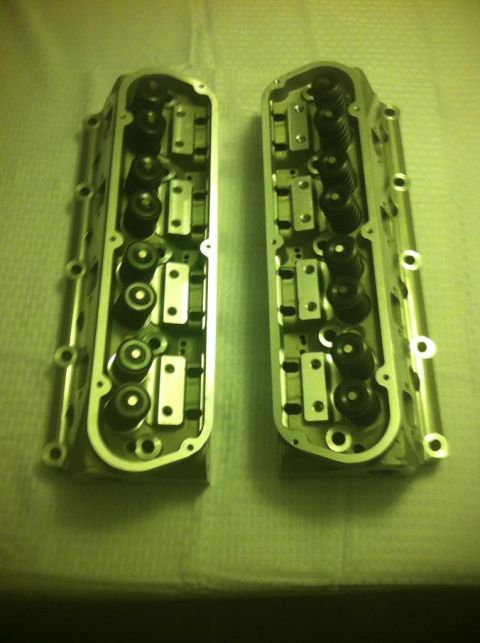 1987 Ford Bronco II - Pair of engine cylinder heads shown from the top, revealing internal valve components.