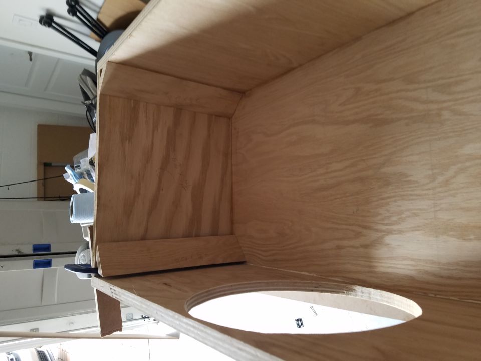 Interior view of a plywood speaker enclosure under construction