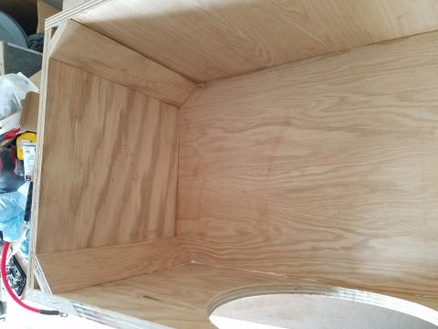 1994 Ford Bronco - Photograph of the interior chamber of a plywood speaker enclosure under construction.