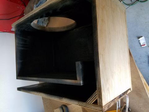 1994 Ford Bronco - Photograph of the interior of a speaker enclosure showing black-coated plywood panels.