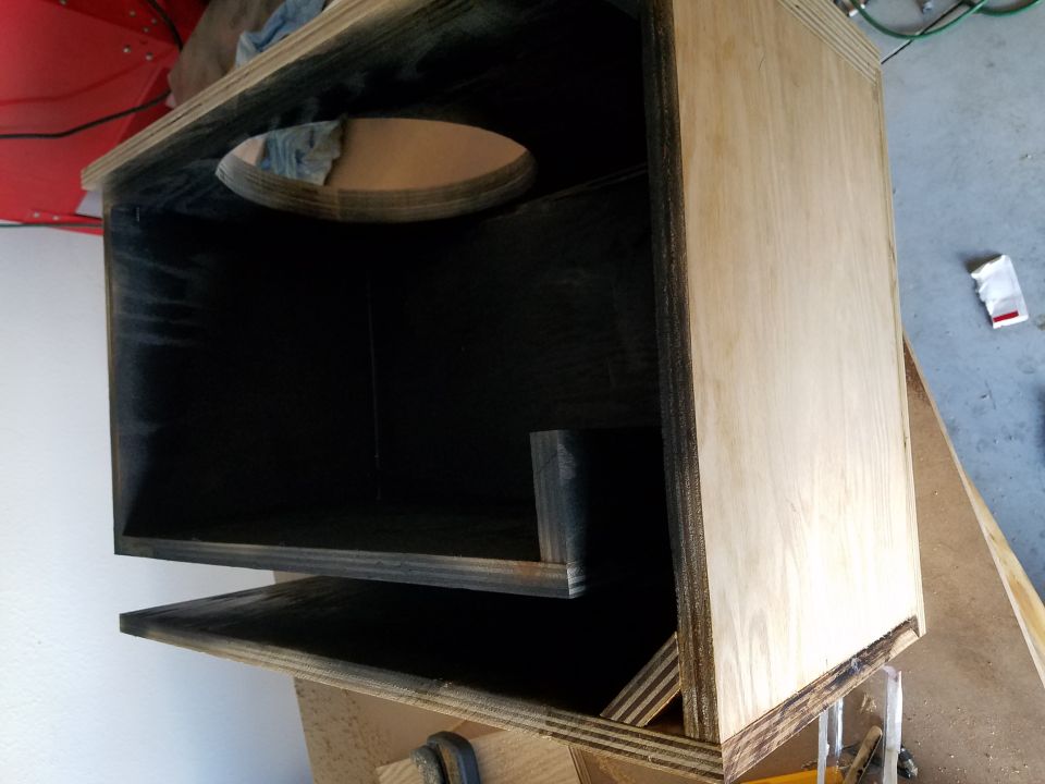 Interior of a speaker enclosure with black-coated panels