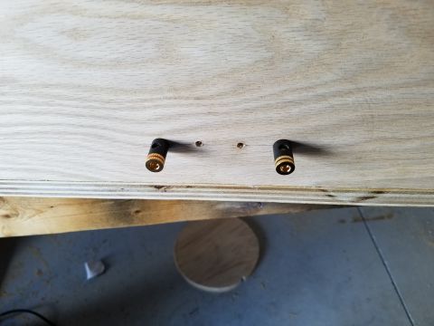 1994 Ford Bronco - Photograph of a pair of gold speaker binding-post terminals fitted into a plywood enclosure panel.